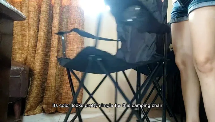 Demonstration of chair weight capacity (testing with different weights).