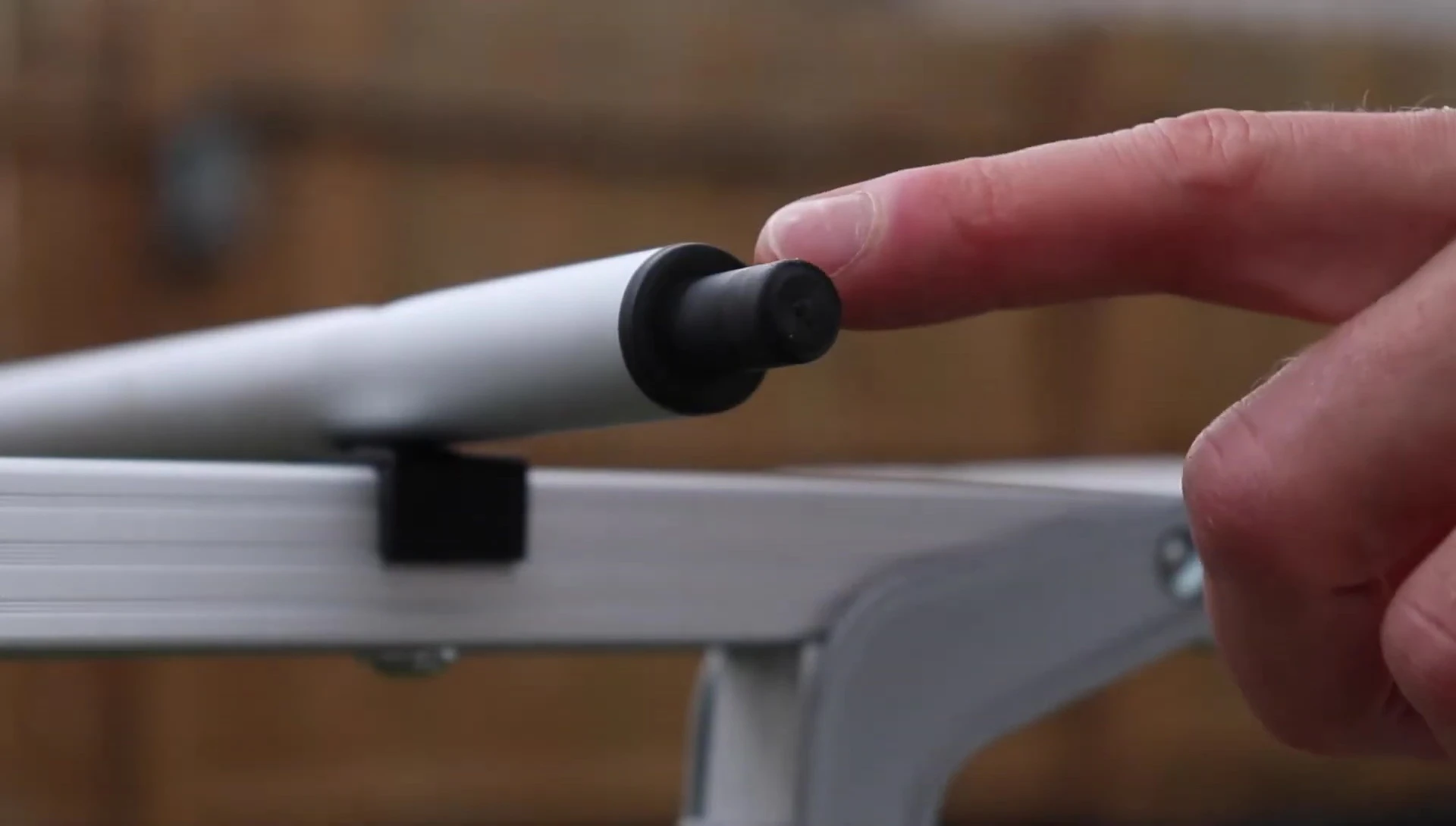 Demonstrating the tabletop's connection to the legs.