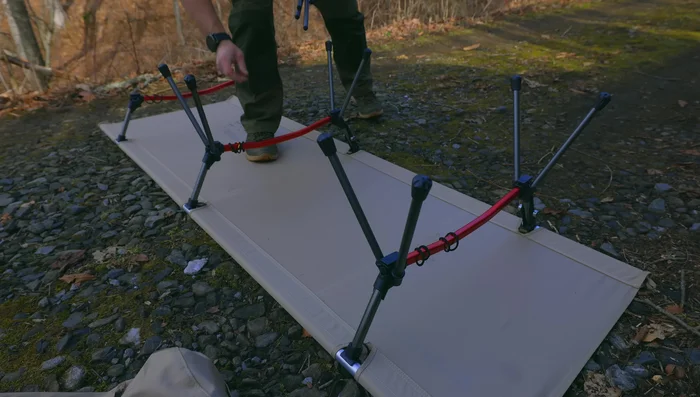 Attach the feet for Setup #2. This raises the cot to 14 1/2 inches high.