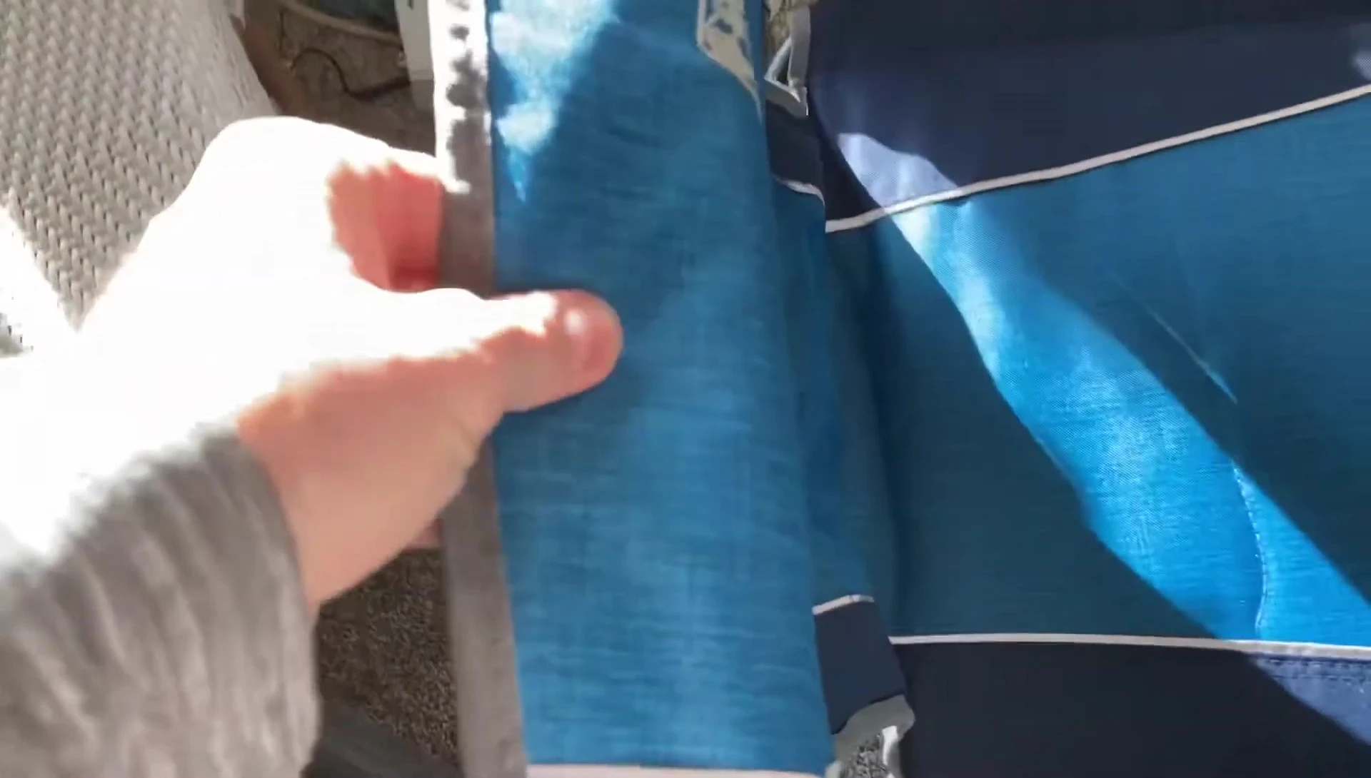 A view of the comfortable fabric and armrests of the chair.