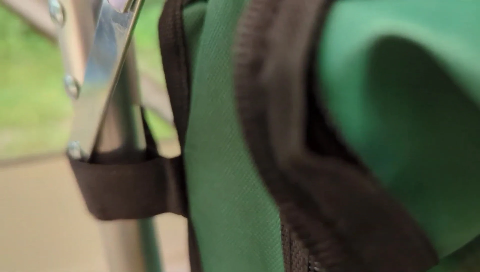 A view of the underside of the table showing the two zippered storage compartments.
