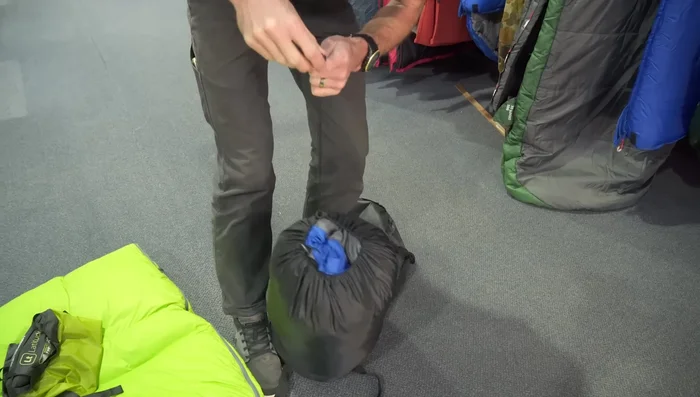 If the compression sack has a cap, secure it.