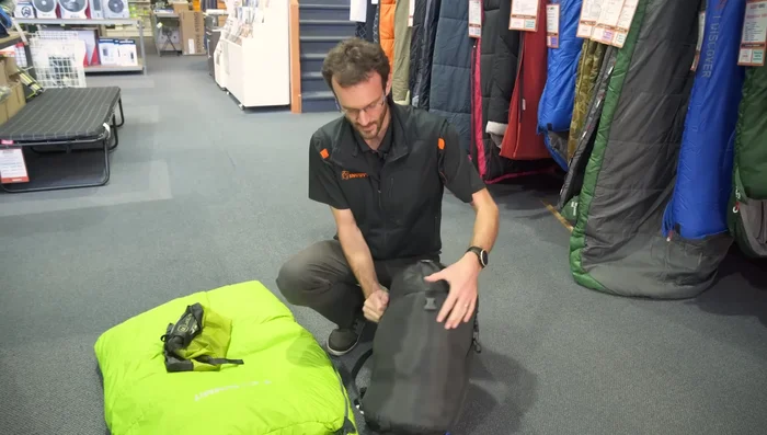 If the compression sack has a cap, secure it.