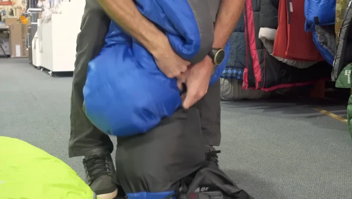 Continue punching and twisting until the bag is fully compressed at the bottom.