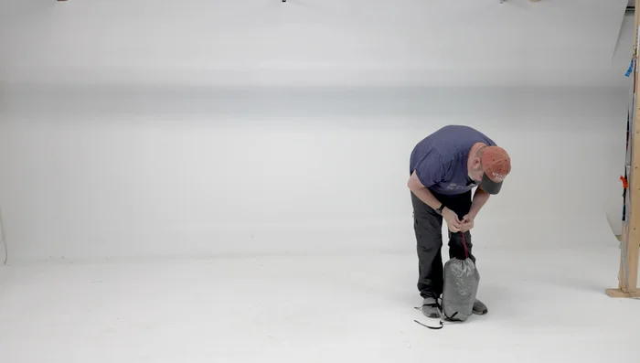 Tighten the straps around the stuff sack until it's compact (about the size of a bowling ball).