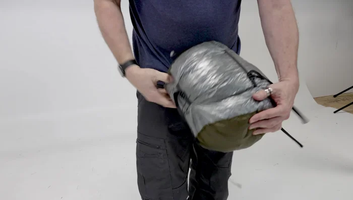 Tighten the straps around the stuff sack until it's compact (about the size of a bowling ball).