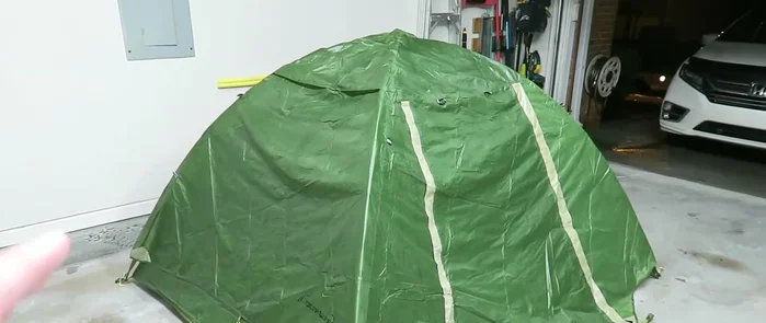 Prepare your tent: Place the rain fly over the tent itself. This allows for easy, complete coverage.
