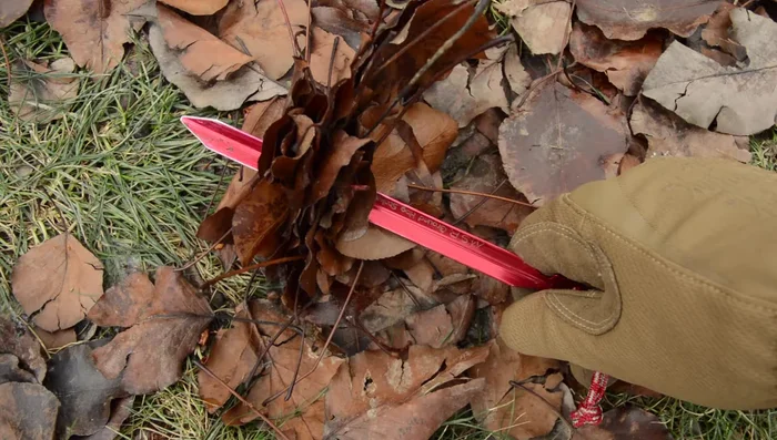 Clear the area of debris before staking to ensure solid ground contact.