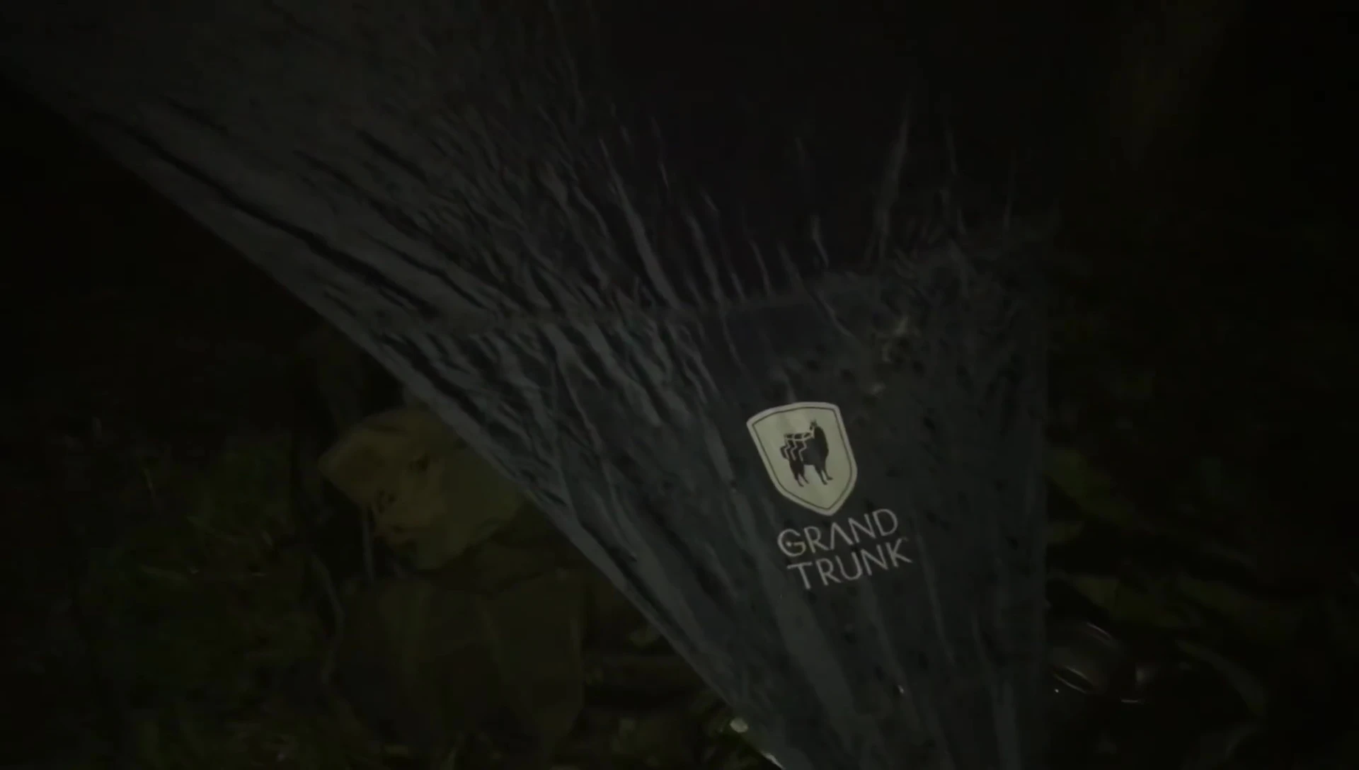 Tarps secured over the hammocks.