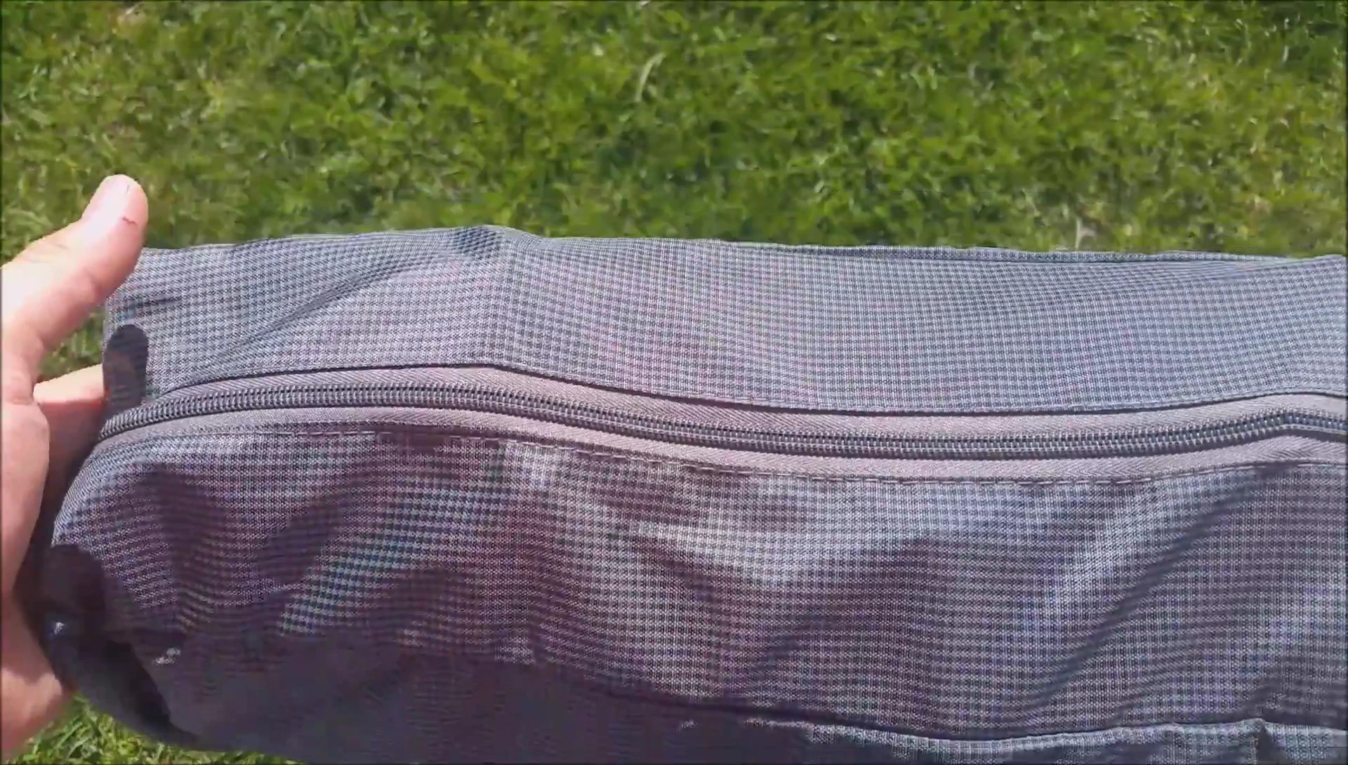 Close-up of the folded KingCamp cot, highlighting its compact size.