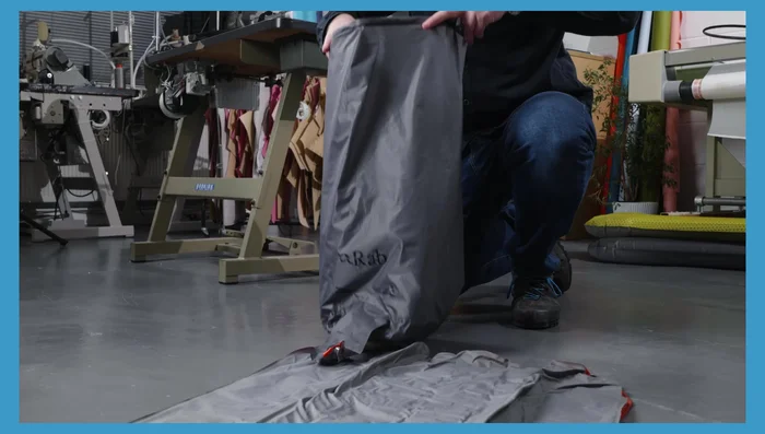 Open the top of the inflation sack to capture air.