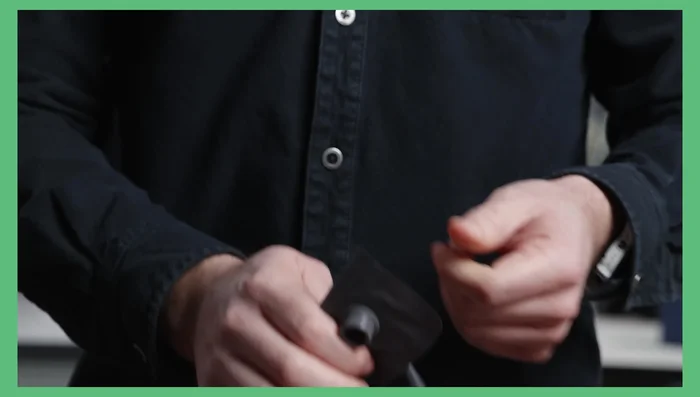 Open the top of the inflation sack to capture air.