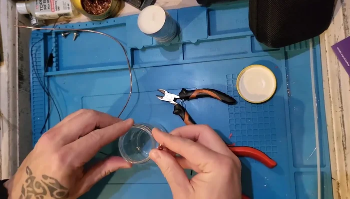 Shape and adjust the wire to ensure it fits the jar comfortably and the handle is secure.