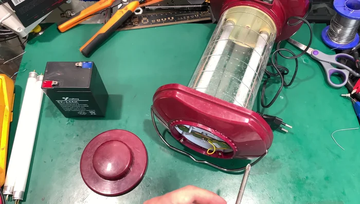 Install the new warm-colored CFL tubes, ensuring proper seating.