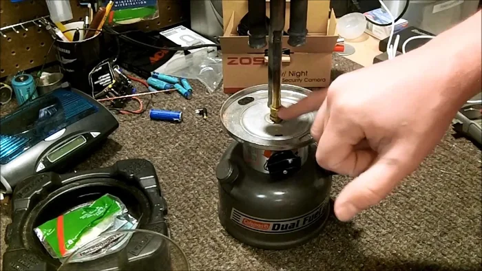 Remove the upper assembly. This involves loosening a jam nut (7/16 inch), removing a C-clip, and carefully lifting off the upper portion.