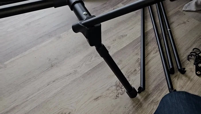 Adjust the height of the table legs using the adjustable feet.