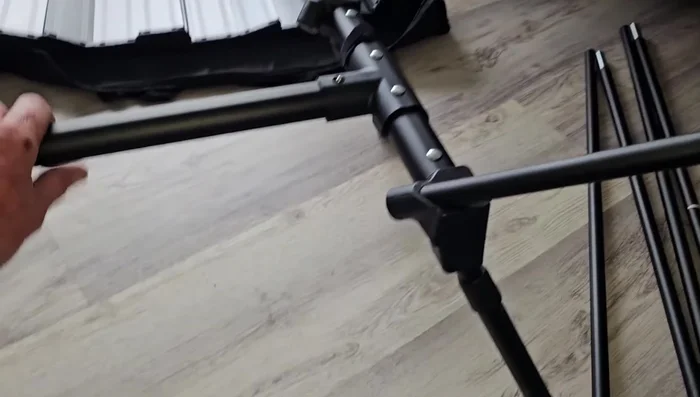 Attach the table legs. Flip the leg bracket, insert legs, and secure with push tabs.