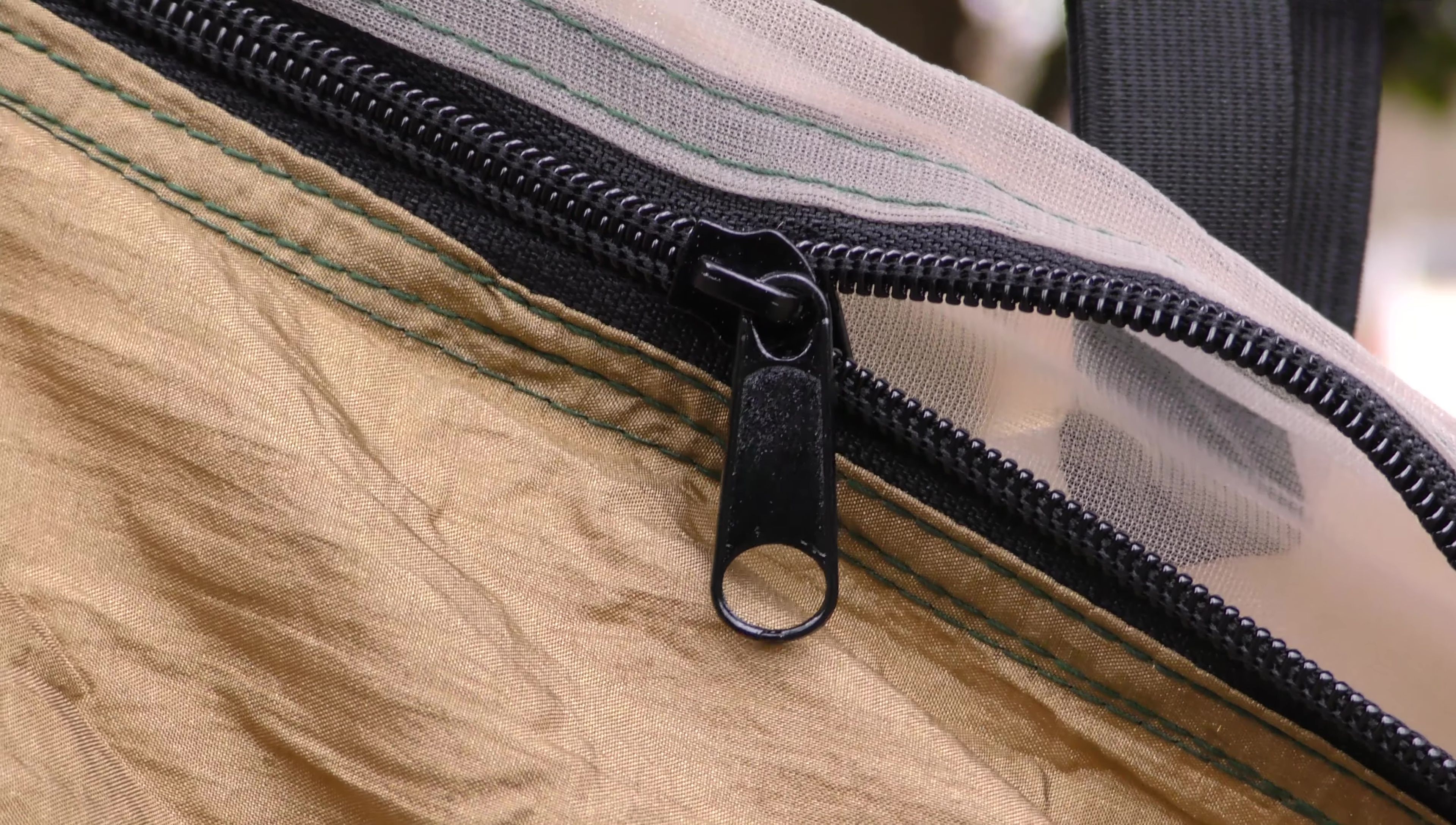 Close-up shot showcasing the quality of the stitching and zippers.