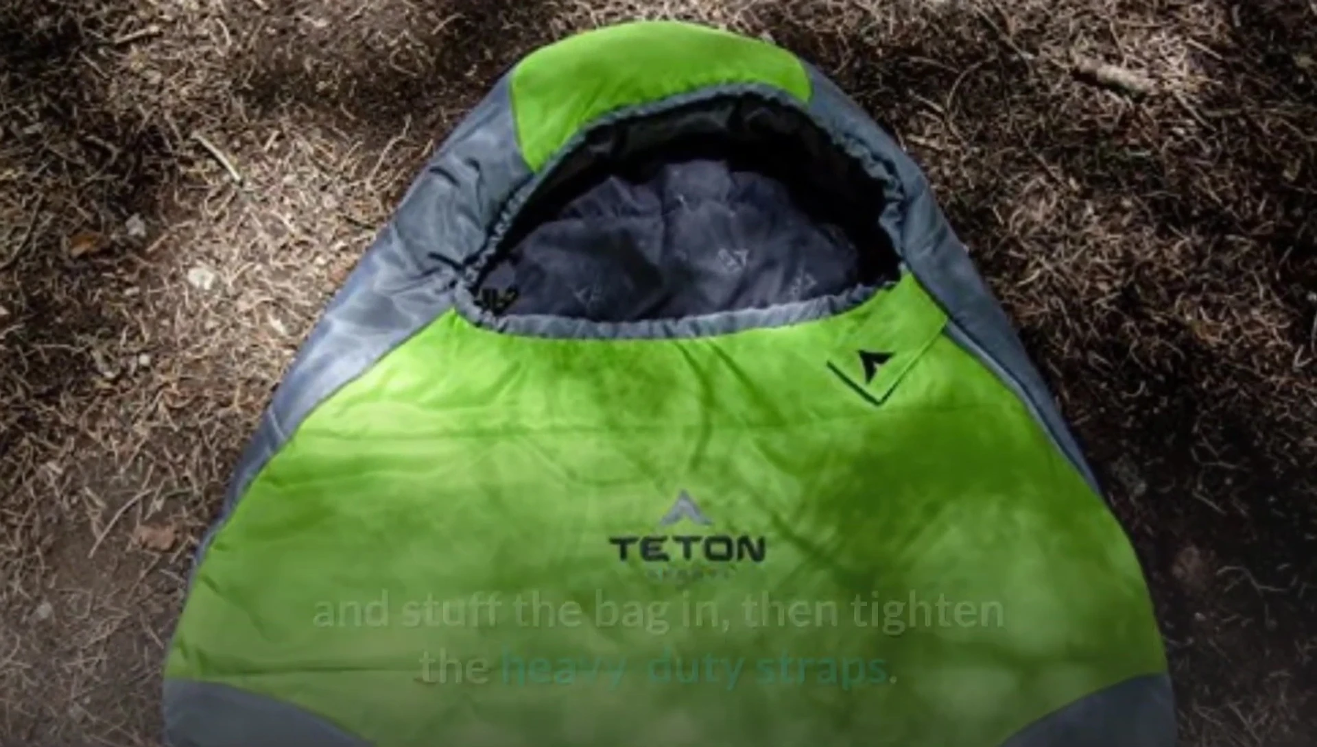 Demonstrating the process of packing the sleeping bag into the compression sack.