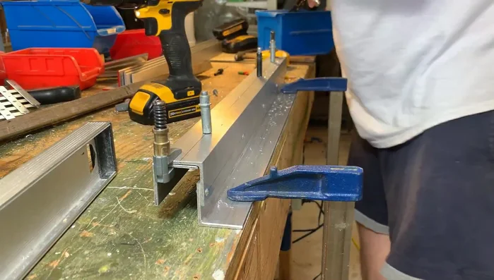 Mark, drill, and rivet the four support pieces together.