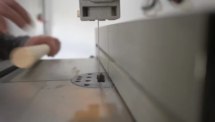 Cut slots on the bandsaw to accommodate wedges for locking the dowels.