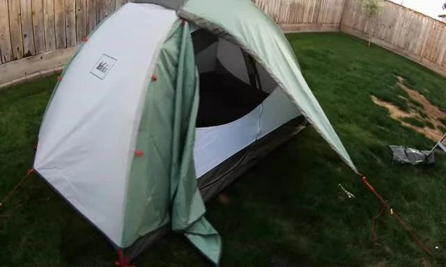 The tent set up, showing the backside and how it's secured.