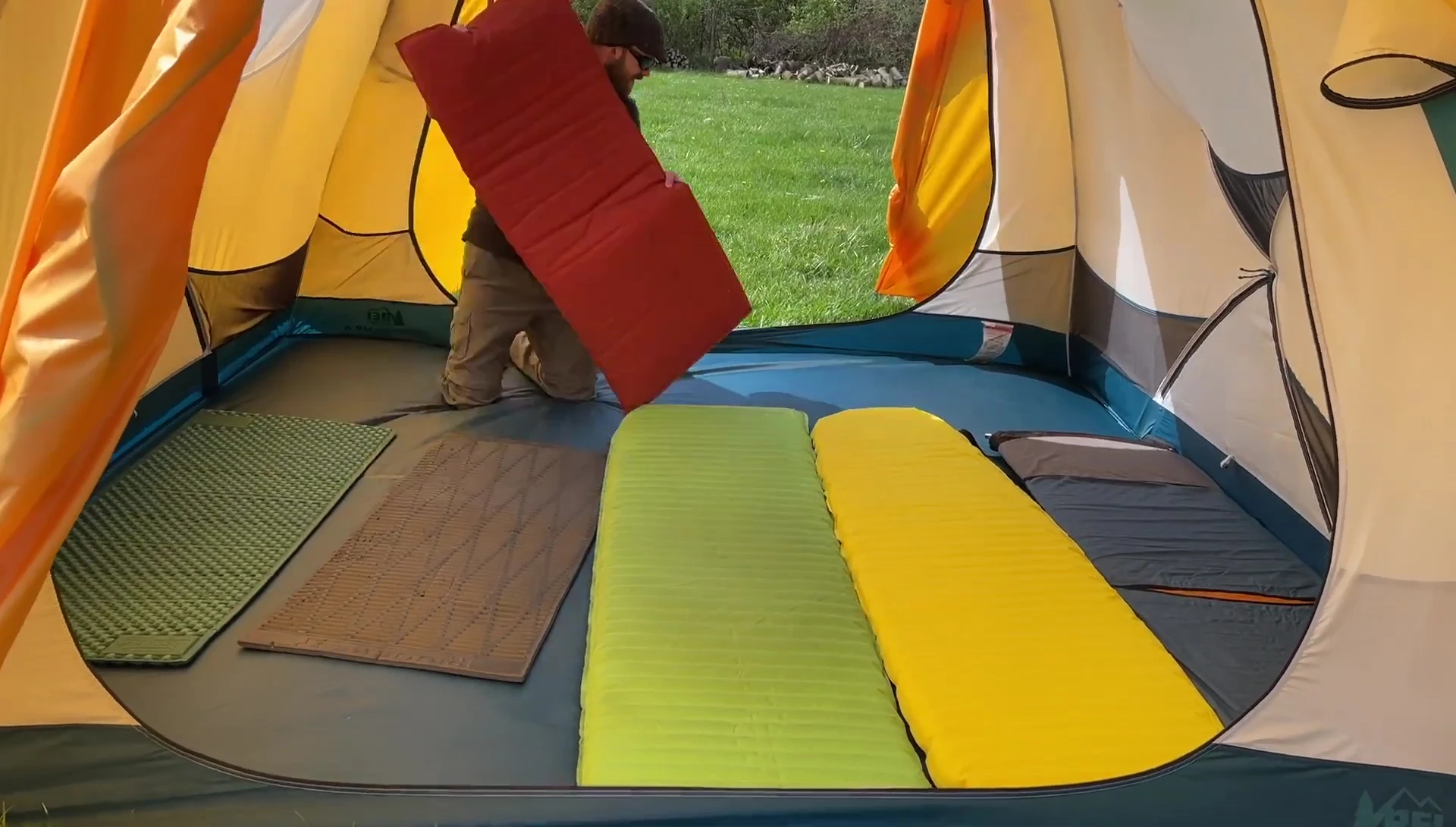 Six sleeping pads inside the tent.