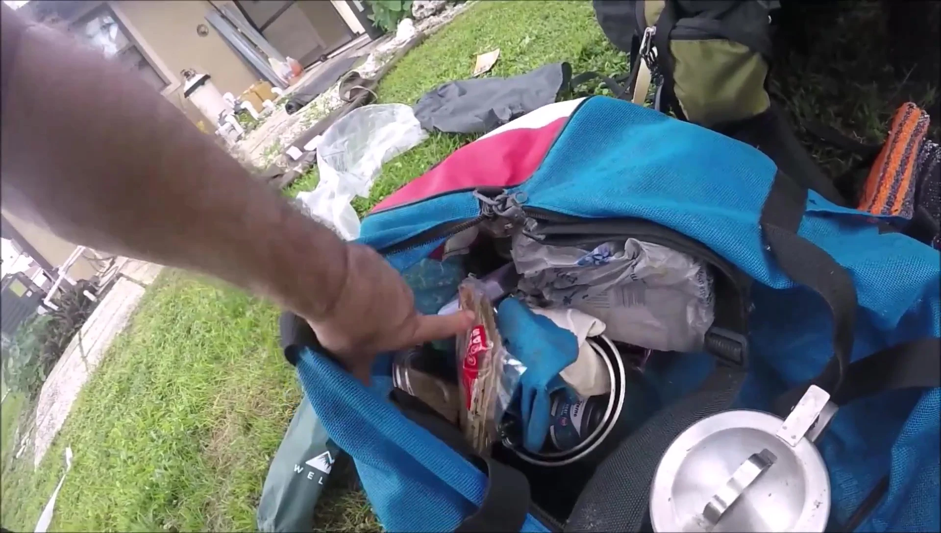 Various camping gear, including the Kelty Tioga backpack.