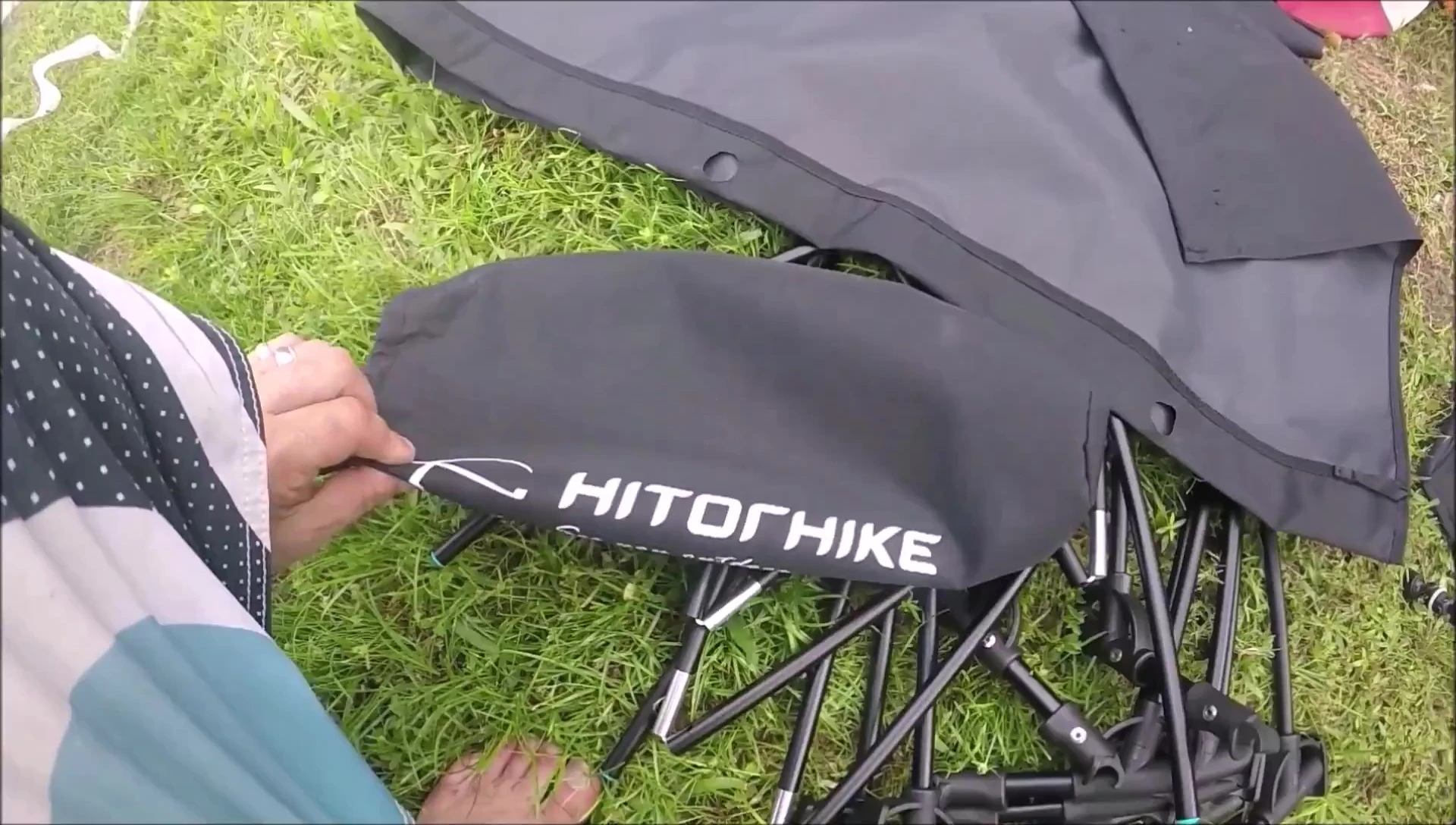 The presenter demonstrating how easy it is to assemble the tent.