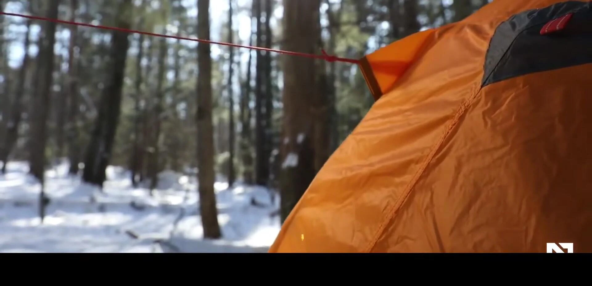 A camping blanket being used at an outdoor event