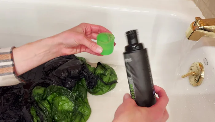 Agitate and soak: Gently agitate the sleeping bag in the soapy water to work the soap in. Let it soak for about 10 minutes.