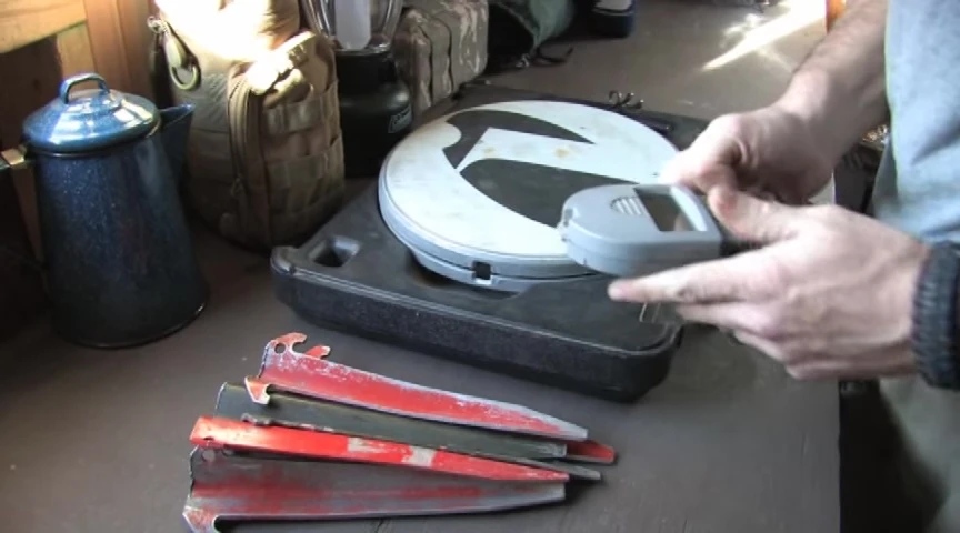 Digital scale being prepared to weigh the tent stakes