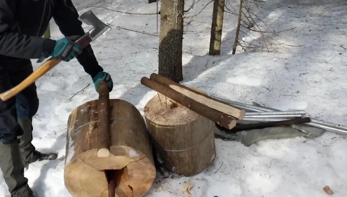 Light the log torch. Use dry branches and wood chips to start the fire.