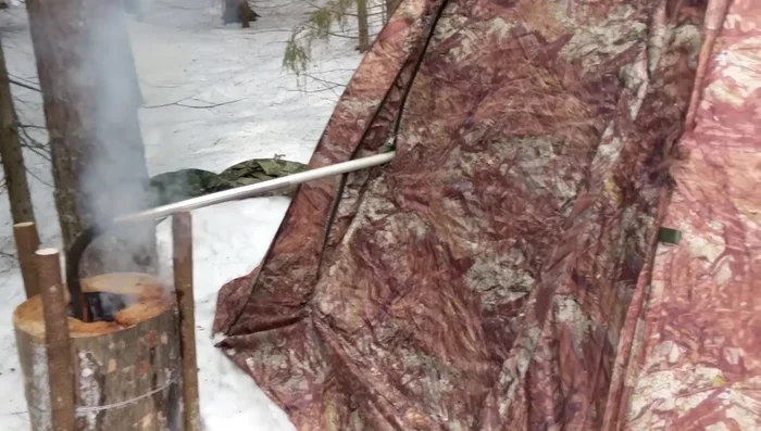 Run the metal pipe from the log torch into the tent through a tent entrance. The fresh air should enter the pipe below the level of the log torch.