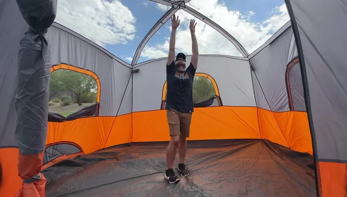 Review of the Core 11-Person Family Cabin Tent: Spacious (17 ft x 12 ft), high center height (86 inches), H2O Block technology, adjustable ventilation, attached screen room.