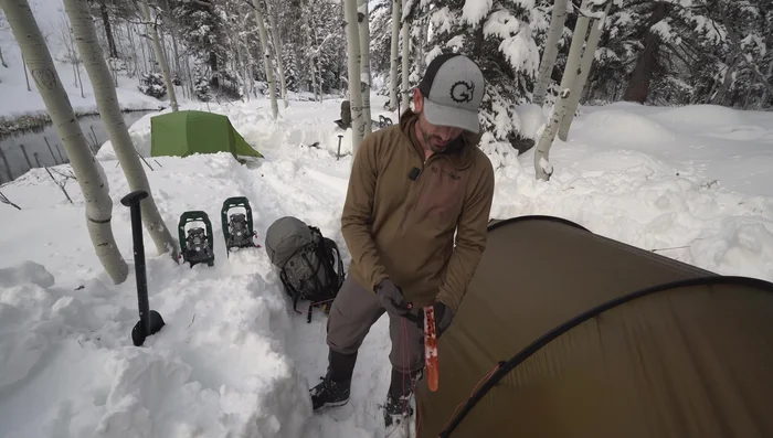 Loop the guideline over each end of the stake, creating an anchoring device.