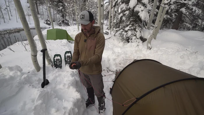 Loop the guideline over each end of the stake, creating an anchoring device.