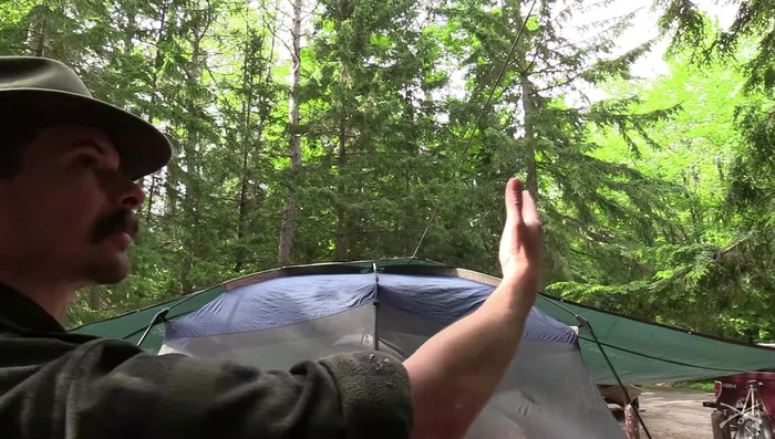 Tighten the side ropes and center rope to straighten the tarp and create a taut setup.