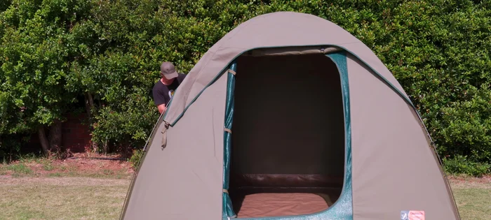 Unroll and partially zip close the inner and outer doors. Don't fully zip them yet.