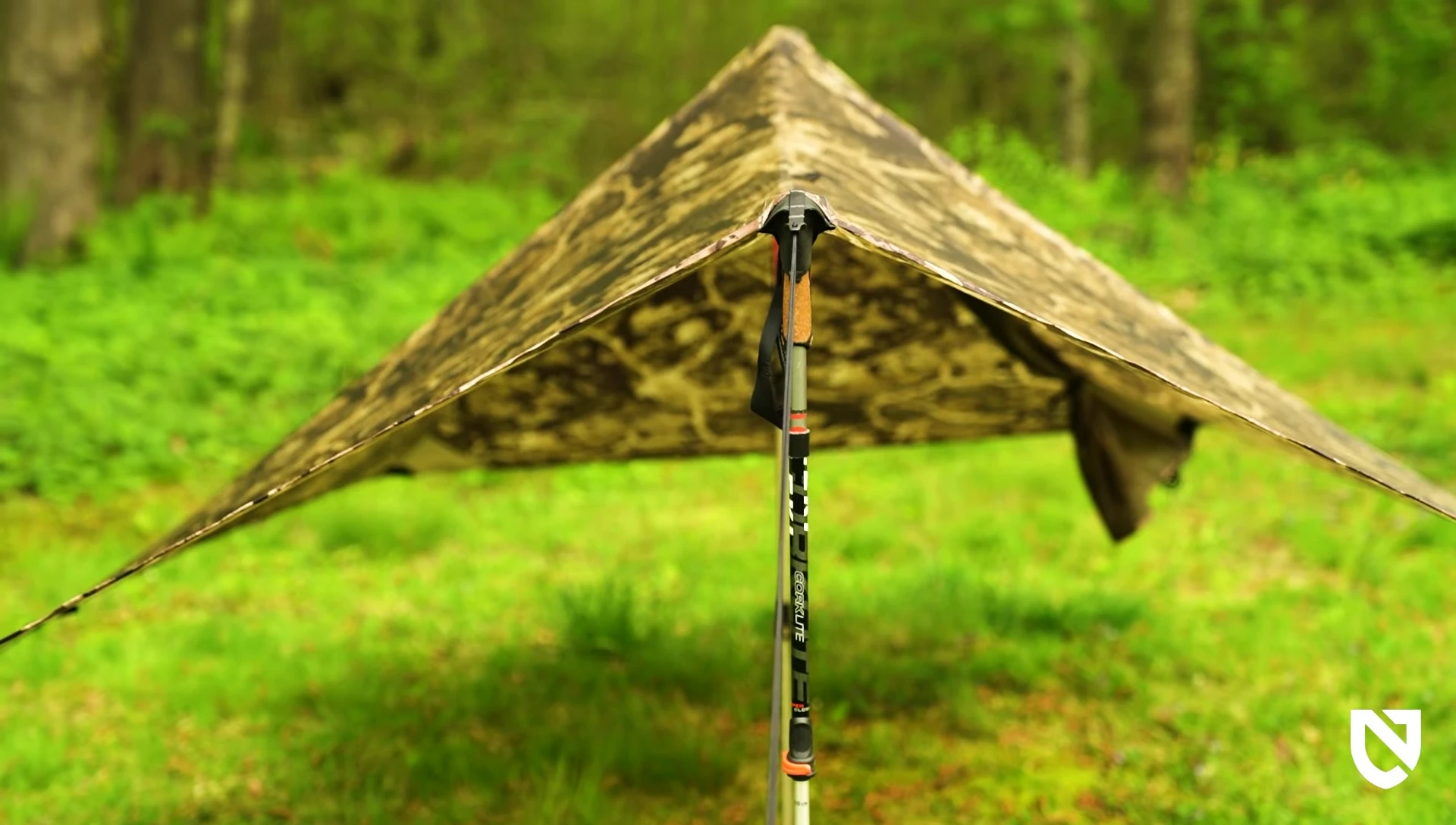 Person quickly setting up the tarp, demonstrating ease of use.