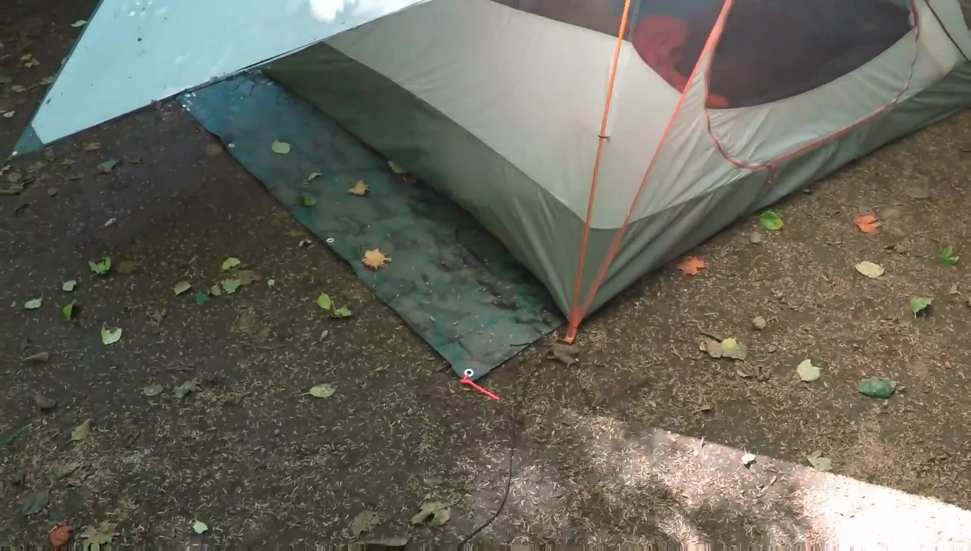 The tarp setup with a groundsheet underneath.