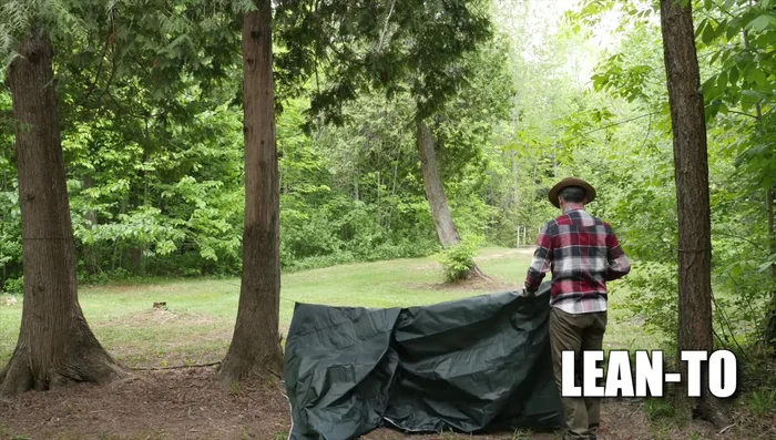 Secure one edge of the tarp to a ridge line.