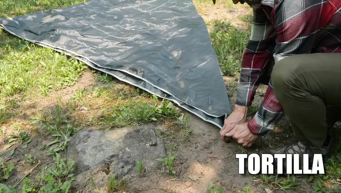 Fold the tarp diagonally.