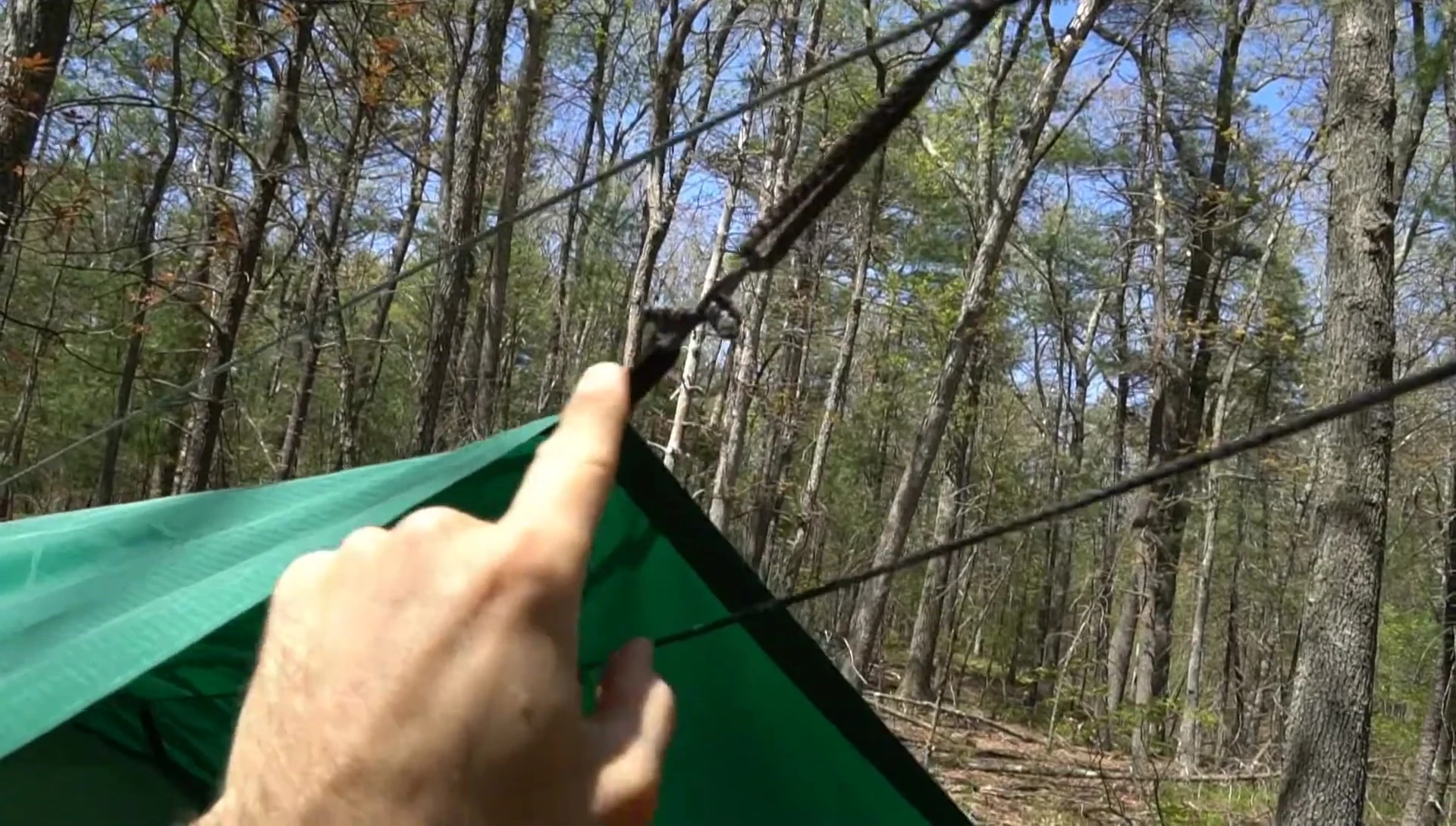 Guide tarp's tie-out system