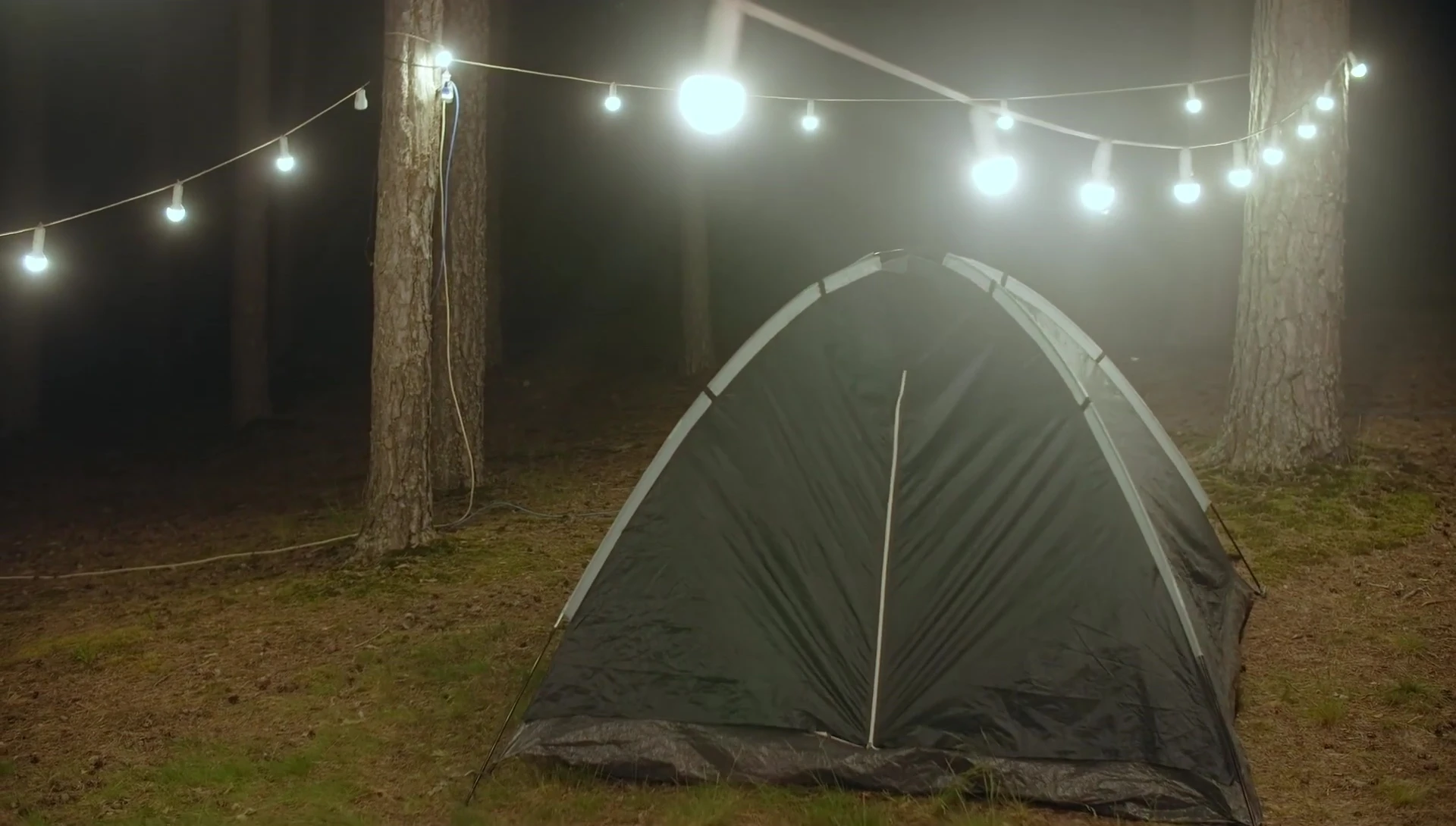 A tent keeping a camper dry in the rain