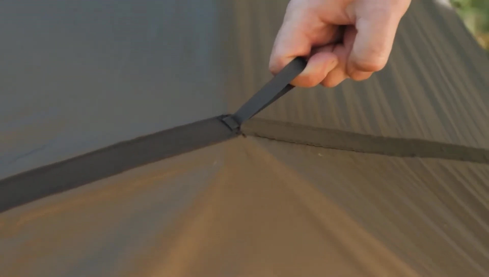 Close-up of the tarp's features: connection points and boa bands