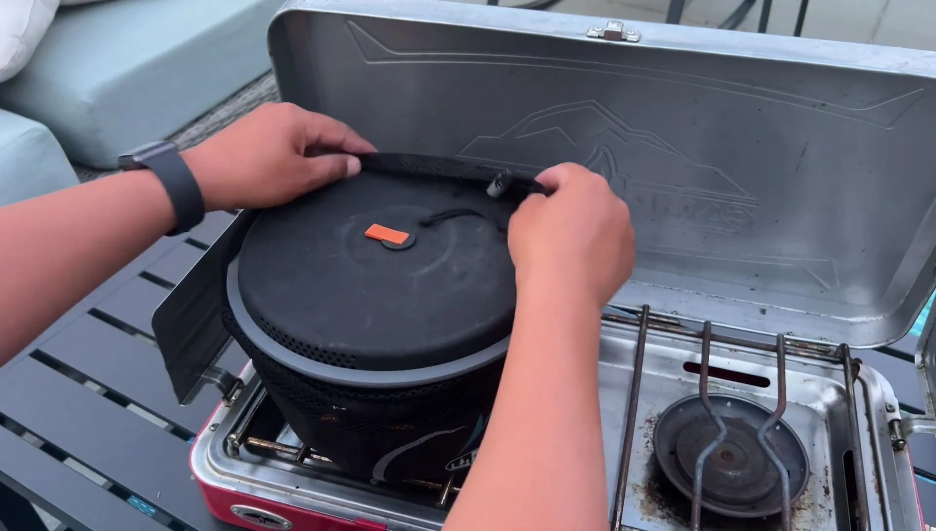 The GSI Pinnacle Camper cookset in its mesh storage bag.