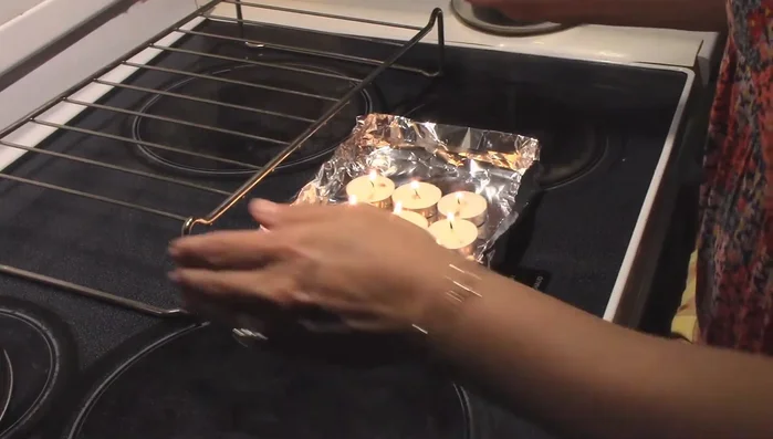 Position the pot: Place a small grate (optional, but recommended for even heat distribution) on top of the candles, then place your pot on the grate.