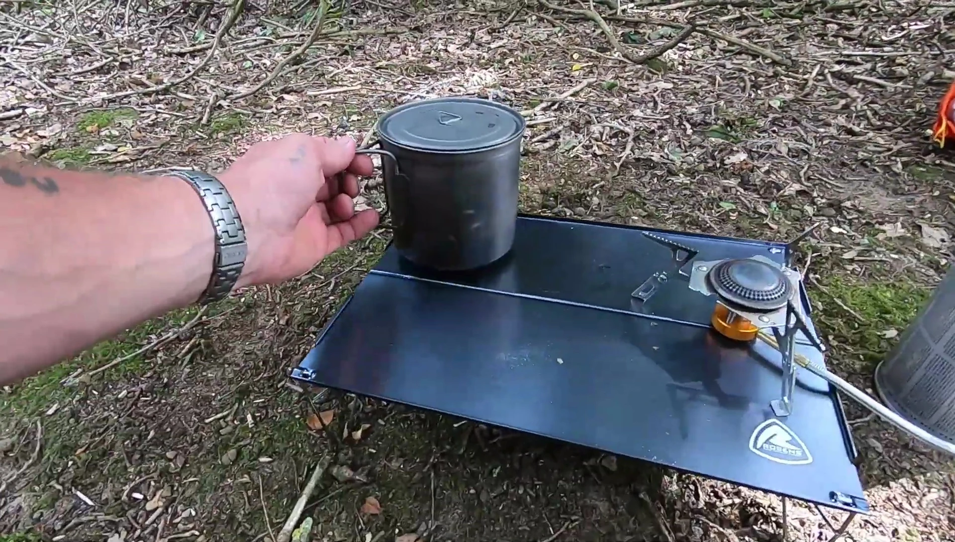 A cooking pot on the table demonstrating the size