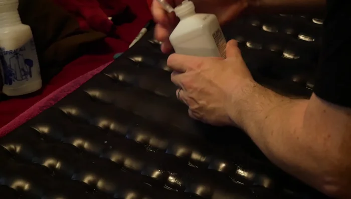 Dry the pad, clean leak areas with rubbing alcohol, and apply sealant to the leaks.